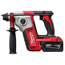 A red and black cordless drill with battery